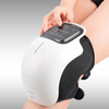 Image of NuLYFF™ Knee Massager on a women's leg. She is enjoying the red light therapy, heat therapy, and high frequency vibration massage therapy as she is getting the relief. She is pressing buttons to adjust the settings for here preferred relief.